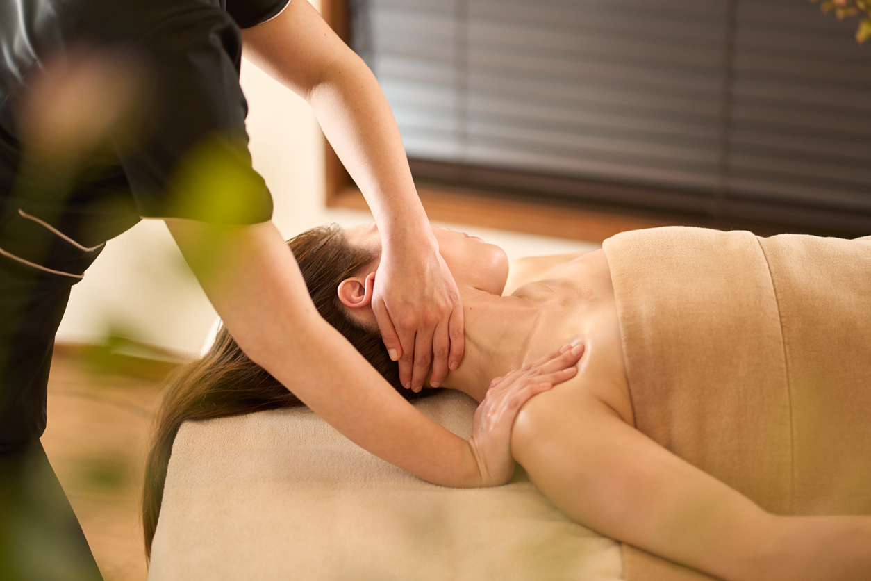 Woman receiving neck massage